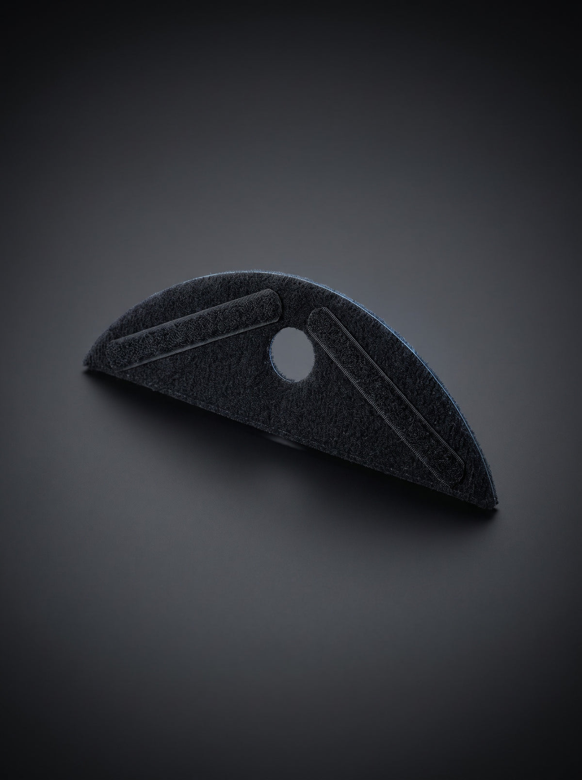 Easi Breezi universal helmet attachment, a black felt crescent with hook-and-loop strips and a centre air hole