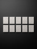 Ten Easi Breezi H11 HEPA replacement filter pads laid out in two rows of five