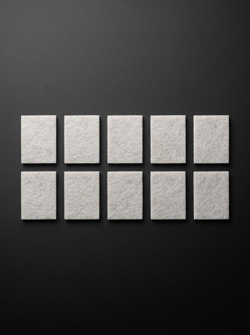 Ten Easi Breezi H11 HEPA replacement filter pads laid out in two rows of five