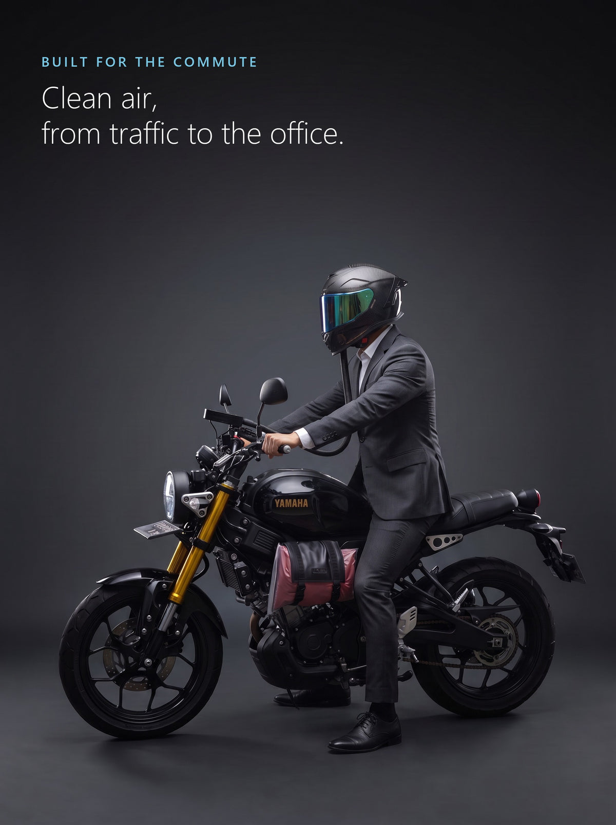Commuter in a suit on a motorcycle with the Easi Breezi air hose connected to his helmet