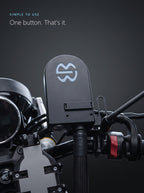 Top-down view of the Easi Breezi unit with its single power button on a motorcycle handlebar