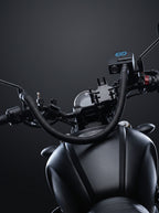 Rider's view of the motorcycle cockpit with the Easi Breezi unit and hose routed across the tank